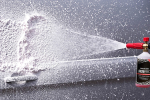 Snow foam being sprayed from a snow foam lance